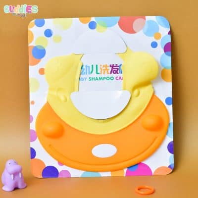 Colorful and soft silicone baby shampoo cap on white background, designed to keep water and soap out of children's eyes during bath time.