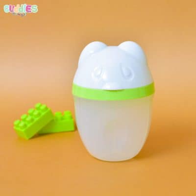 Milk divider tripod resting securely on a baby bottle, designed for easy, precise milk powder dispensation, made from durable, food-safe materials.