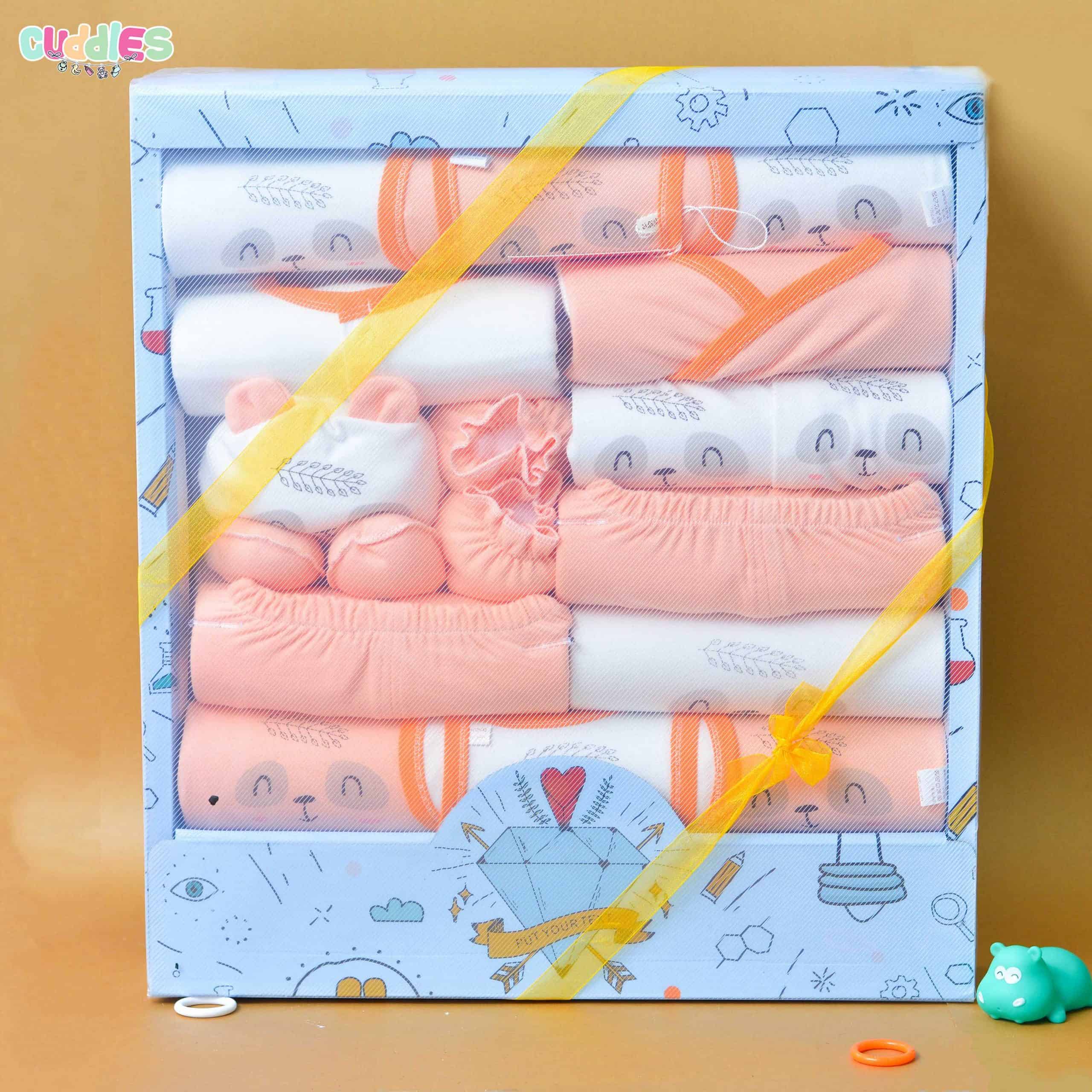 Newborn Gift Box Set featuring 18 essential baby items including clothing, blankets, a plush toy, and more, beautifully packaged, perfect for welcoming a new baby